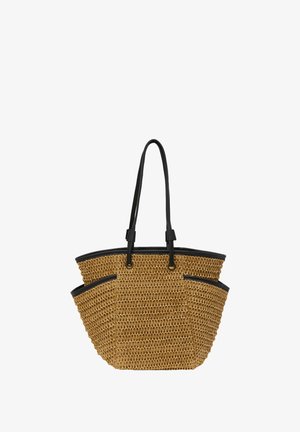 Woven straw tote bag with black leather trim and handles, featuring two front pockets and a spacious, open interior.