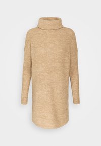 Pull à col roulé beige avec une texture côtelée, doté de manches longues et d'une coupe décontractée. Le tissu semble doux et chaud.
