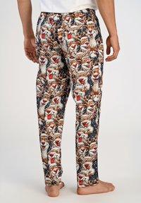 Katoenen pyjamabroeken met een feestelijk ontwerp van meerdere cartoon rendiergezichten op een donkere blauwe achtergrond met sneeuwvlokaccenten.