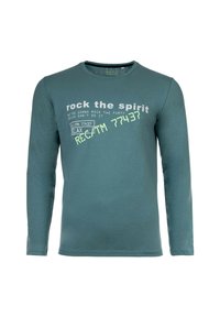 Teal-paita pitkähihaisella varrella, jossa on valkoista ja vihreää painettua tekstiä: "rock the spirit" sekä erilaisia lauseita ja rento istuvuus.
