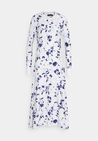 Robe florale avec une base blanche ornée de motifs de fleurs bleues, manches longues et un col buttonné. Tissu doux au design fluide.