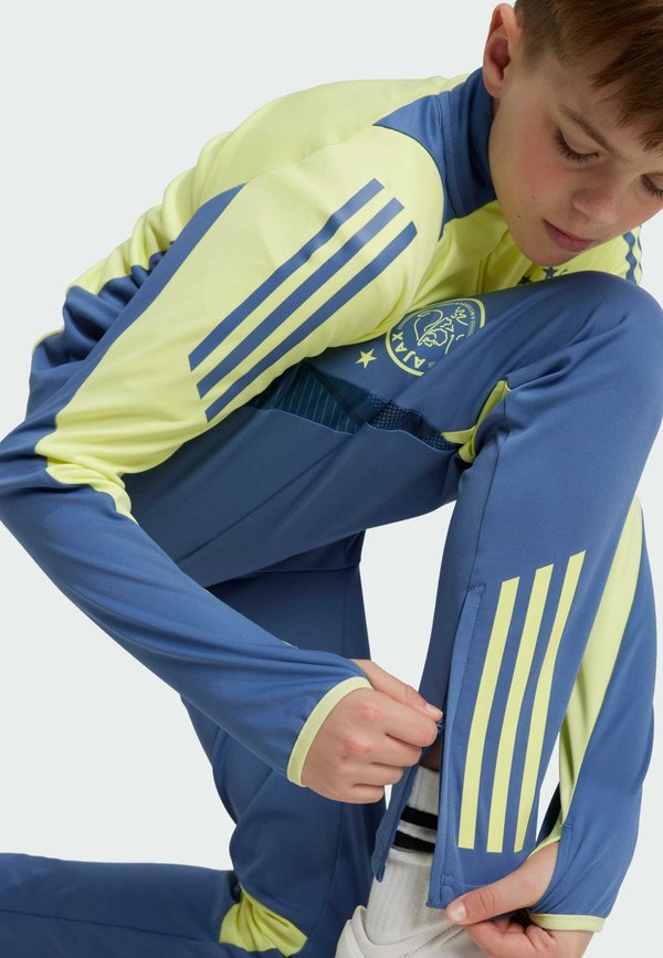 AJAX AMSTERDAM TIRO 24 COMPETITION PANTS KIDS - Club wear4