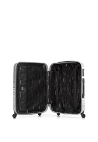 Silver hard-shell suitcase with an open zipper, featuring a black lined interior with diagonal straps and a side zip pocket.