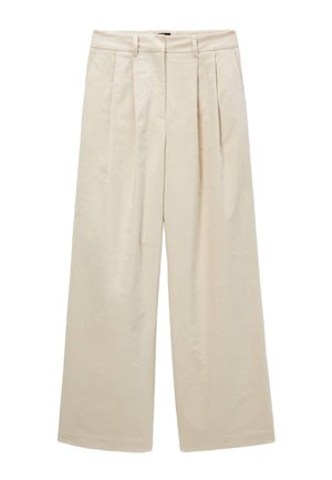 Pantalons larges beiges avec des plis, taille haute et texture en coton lisse. Présente un design minimaliste sans élément de quincaillerie visible.