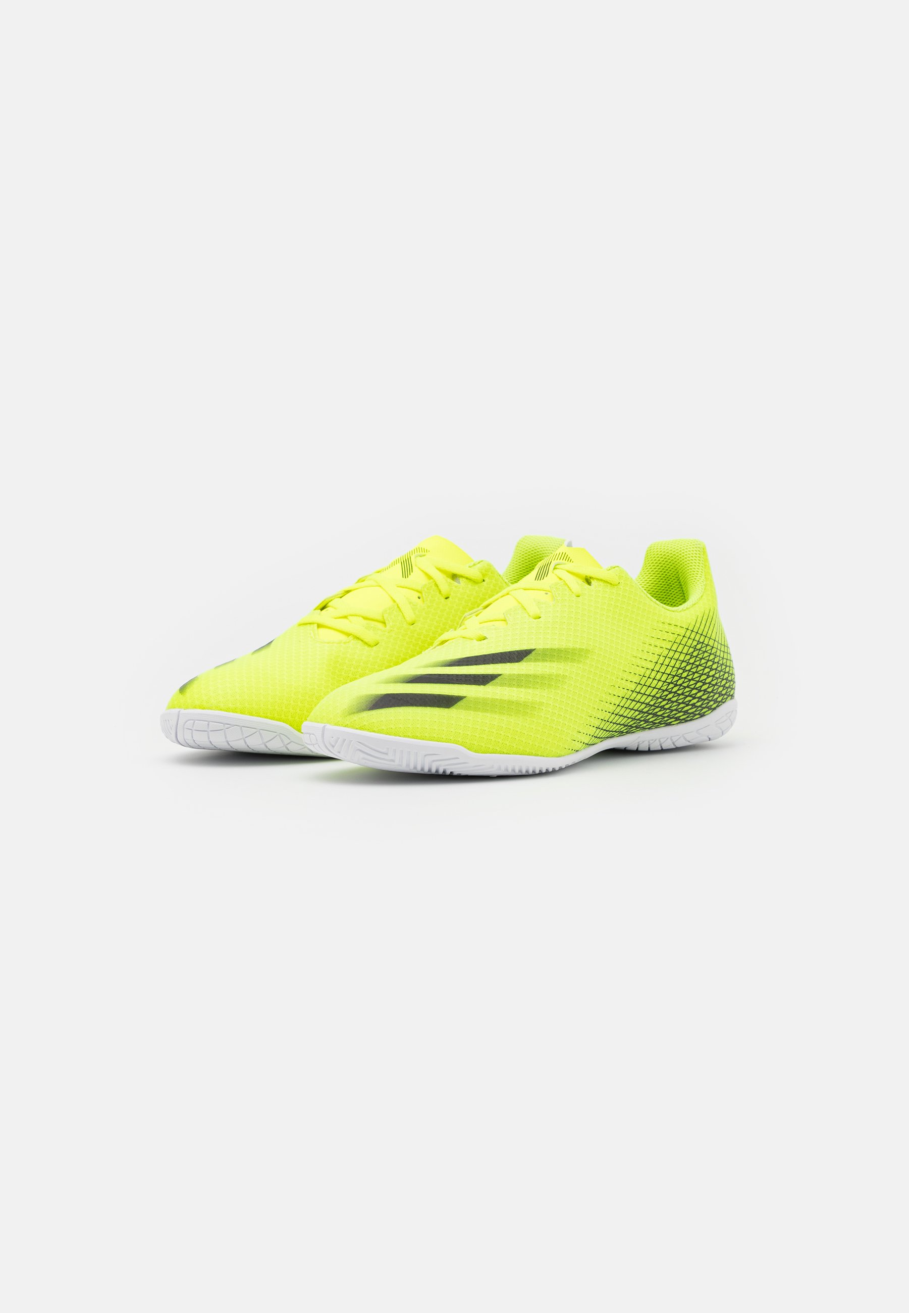 black adidas with yellow