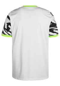 Biała koszulka z krótkimi rękawami w czarno-białe wzory. Neonowo zielone akcenty przy kołnierzyku i brzegach rękawów. Gładki, lekki materiał.