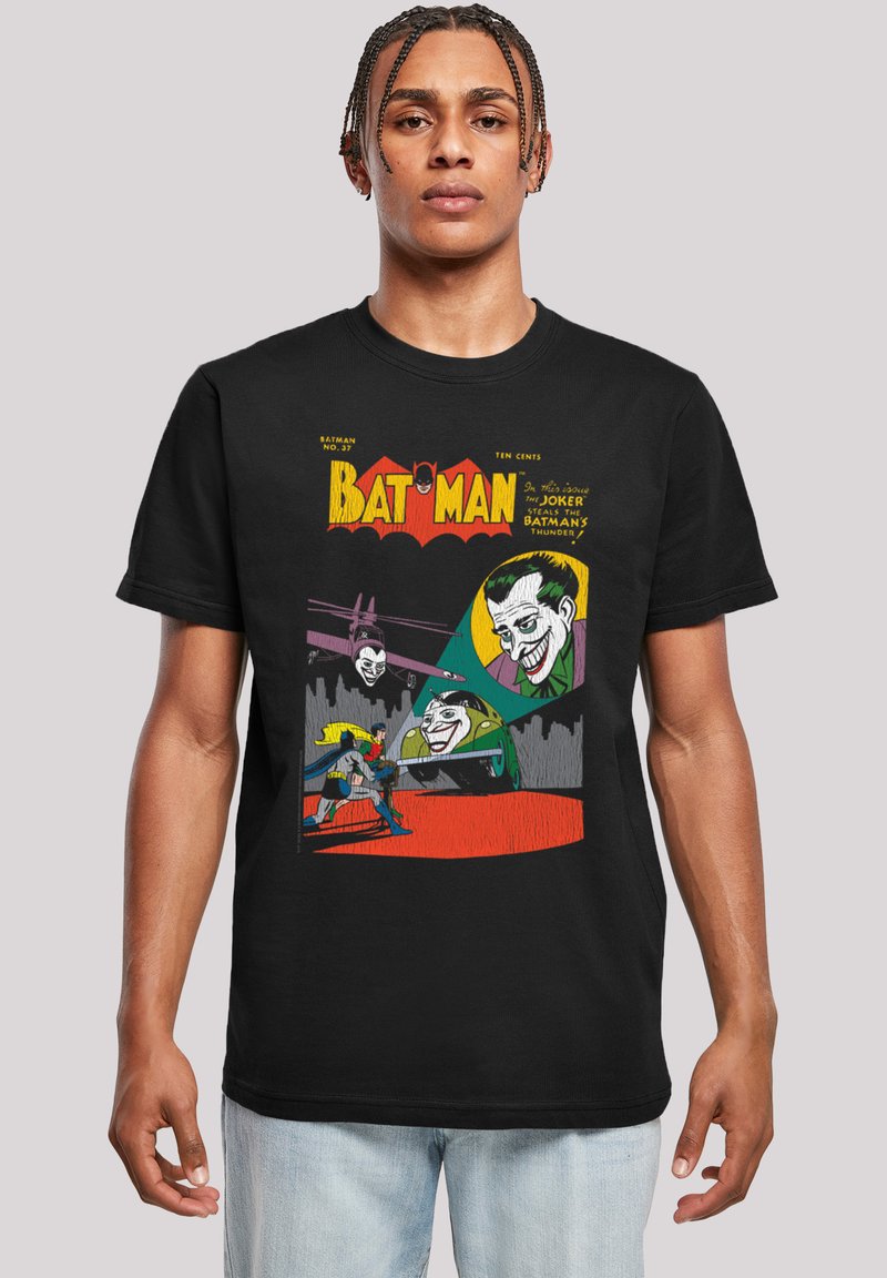 Svart T-skjorte med fargerik Batman- og Joker-grafikk, vintage tegneseriestil med fet tekst og detaljerte karakterillustrasjoner.