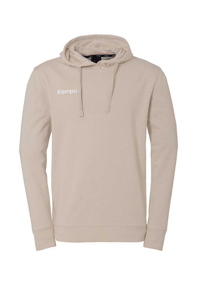 Felpa beige realizzata in tessuto morbido, con cappuccio regolabile, maniche lunghe e un logo "Kempa" bianco sul petto.
