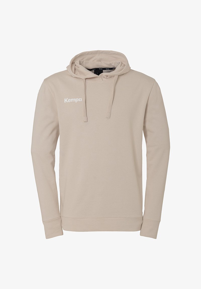 Felpa beige realizzata in tessuto morbido, con cappuccio regolabile, maniche lunghe e un logo "Kempa" bianco sul petto.
