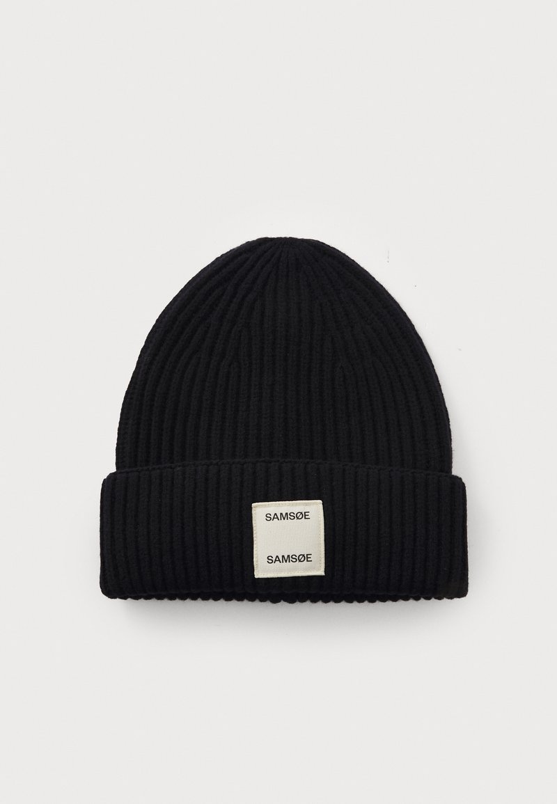 Black ribbed knit beanie with folded cuff featuring a white square label displaying the brand name "SAMSØE" twice.
