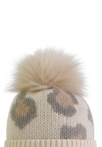 Knit beanie in cream with fuzzy light brown pom-pom, featuring leopard print patterns in beige and gray. Textured ribbed cuff at the base.