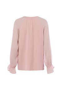 Hellrosa Bluse mit langen, puffigen Ärmeln. Hergestellt aus strukturiertem Stoff, mit elastischen Bündchen und einem einfachen, runden Ausschnitt.