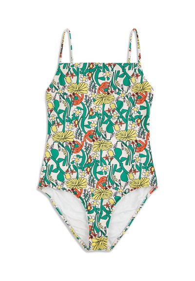 Maillot de bain une pièce à fines bretelles, présentant un motif floral coloré avec des feuilles vertes, des fleurs jaunes et orange sur un fond blanc.