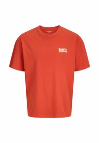 Camiseta de algodón roja con mangas cortas y cuello redondo. Presenta "SAINT TROPEZ" impreso en blanco en la zona izquierda del pecho.