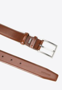 Brown leather belt with a silver rectangular buckle. The belt features a smooth texture, clean lines, and a brand embossed at the tail end.