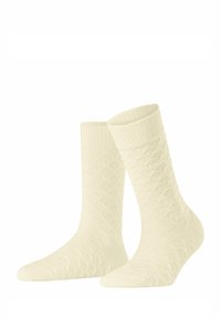 Chaussettes de couleur crème avec un motif texturé pr�ésentant des losanges en relief, un revers côtelé et une finition douce et tissée.