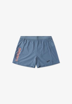 Heledad sinine jooksupüksid, mis on valmistatud hingavast materjalist, elastse vöökoha, küljetaskute ja suure oranž „BROOKS“ logoga.