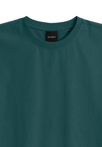 Turkusowa koszulka z krótkim rękawem z miękkiej bawełny, z okrągłym dekoltem i oznaczeniem marki pośrodku. Rozmiar M.