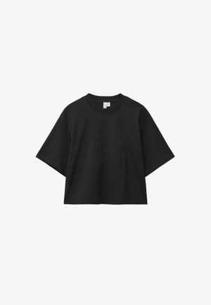 T-shirt nera corta in cotone, con scollo tondo e maniche corte larghe. Texture liscia, design minimalista.