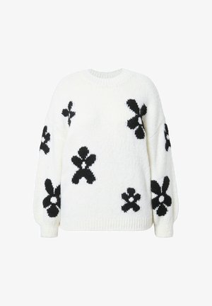Maglione bianco lavorato a maglia con motivi floreali neri, scollo rotondo e maniche leggermente a sbuffo. Texture morbida e vestibilità rilassata.