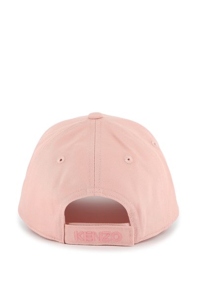Pink baseball cap with a textured fabric, adjustable back strap, and embossed "KENZO" logo on the rear. Features ventilation eyelets.