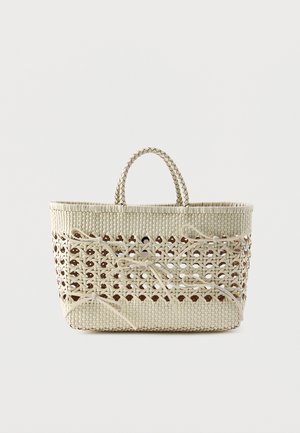 Woven beige tote bag with open lattice center and multiple tied bows, featuring short, braided handles.