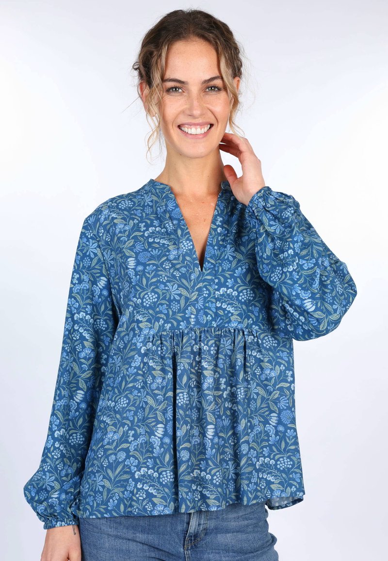 Bluse mit blauem Blumenmuster, langen Puffärmeln und V-Ausschnitt. Aus leichtem Stoff gefertigt, am Bund gerafft für einen lässigen Schnitt.