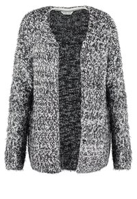 Texturerad kofta i svart och vitt, öppen framdesign, med mjukt, fluffigt tyg. Långa ärmar och utan knäppning. Avslappnad och ledig passform.