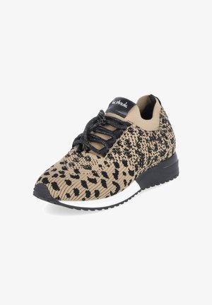 Beige and black knit sneaker with leopard print pattern, black laces, and black-and-white sole, featuring a black tongue label.
