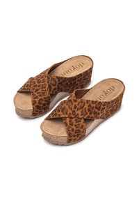 Leopard print wedge sandals with cross straps, suede-like texture, light brown platform, and rounded toe. Cork-like sole provides grip.