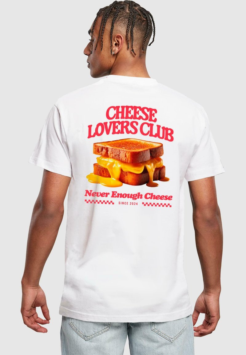 White t-shirt featuring a graphic of toasted bread with melted cheese, text "CHEESE LOVERS CLUB" in red, and "Never Enough Cheese" below.