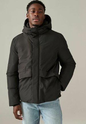 Black padded jacket with a high collar and hood. Features a front zipper, elastic cuffs, and a cinched waist for a fitted look.