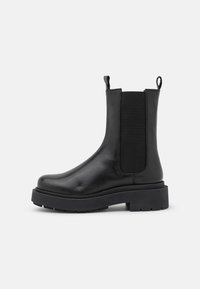 LEATHER - Botas de tornozelo com plataforma - black