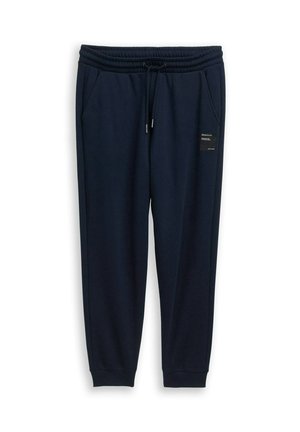 Donker marineblauwe joggerbroek met elastische tailleband, trekkoord, zijzakken, geribbelde manchetten en een klein zwart label op de rechterdij.