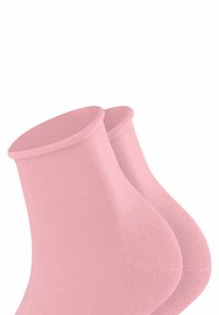 Chaussettes de cheville roses en tissu tricoté doux. Légères avec un poignet côtelé et une texture lisse, idéales pour une tenue décontractée.