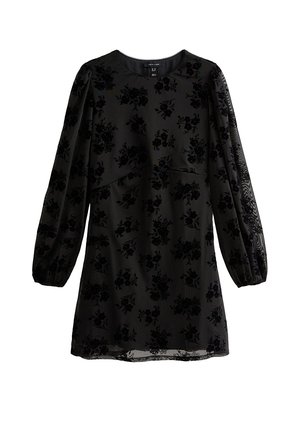 Vestido negro con mangas largas abullonadas, patrón de flores en terciopelo, escote redondo y silueta ligeramente acampanada. Textura suave con detalles translúcidos.