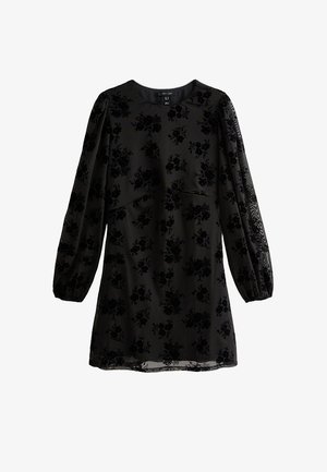 Zwarte jurk met lange pofmouwen, bloemenfluwelen patroon, ronde halslijn en een licht uitlopende silhouet. Zachte structuur met doorschijnende accenten.