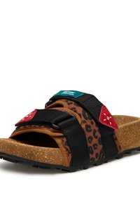 Brown and black leopard print sandals with black straps, red and teal accents. Cork footbed, textured sole, adjustable buckle closure.