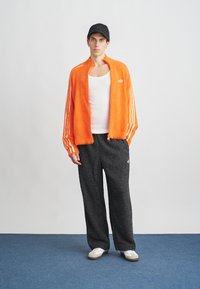 adidas Originals Calças de fato de treino - black