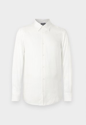 Balta krekla ar garām piedurknēm, vertikālām svītrām, ar pogu stiprināmu apkakli un priekšējo pogu aizdari. Mīksts audums ar gludu faktūru.