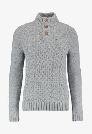 Light gray knit sweater with a high collar, featuring a textured cable pattern and three brown buttons at the neck. Ribbed cuffs and hem.
