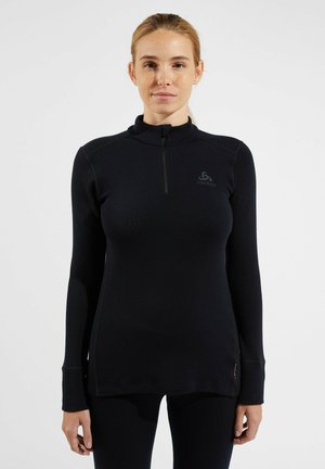 Schwarz langärmliges Thermoshirt mit Reißverschlusskragen, das über ein tailliertes Design und ein Logo auf der Brust verfügt. Hergestellt aus einem glatten, dehnbaren Material.