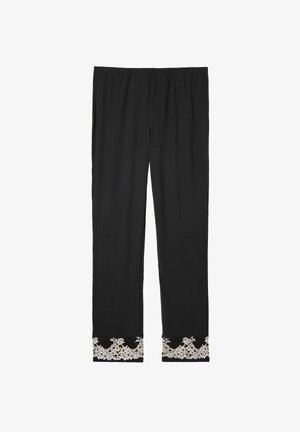 Pantalons noirs avec une taille élastique, ornés de dentelle florale au bas. Fabriqués en tissu doux avec un design à jambe droite.