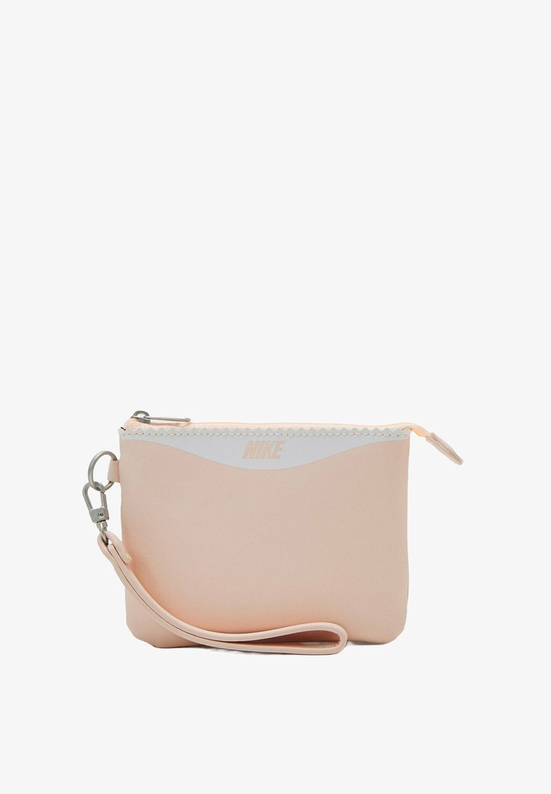 Pochette sintetica rosa con un motivo a onde bianche, cerniera argentata e cinturino staccabile. Presenta il logo Nike in rilievo sul davanti.