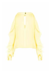 Blusa gialla con maniche lunghe, presenta un'apertura a occhiello sulla schiena e dettagli arricciati sulle maniche. Realizzata in tessuto leggero.