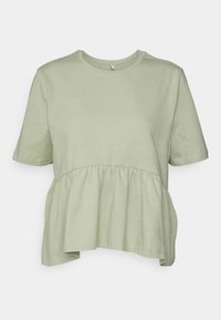 Světle zelené tričko s kulatým výstřihem, krátkými rukávy a nařaseným peplum designem v pase. Měkká, lehká tkanina.