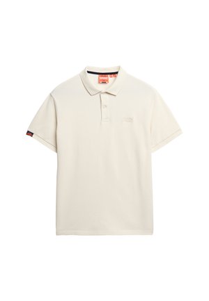 Cream-colored polo shirt made of cotton, featuring a two-button placket, short sleeves, and a small logo on the chest and sleeve.