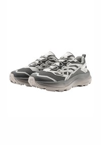Gray and white athletic shoes with mesh upper, thick rubber sole, and textured accents. Features a modern design with flexible laces.