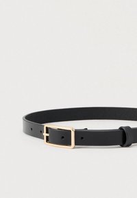 Black leather belt with a smooth texture, featuring a rectangular gold metal buckle and multiple adjustment holes. Thin and minimalist design.