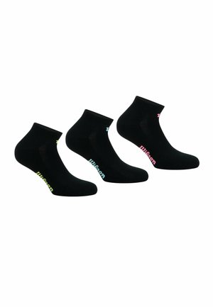 Chaussettes noires à la cheville en pack de trois, avec des logos colorés en rose et vert sur les côtés. Texture lisse, matériau extensible.